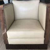 Two armchairs and an Art Deco style pouf