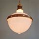 Large Art Deco pendant light in milk glass and brass, 1920s