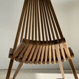 Foldable designer armchair in wooden slats