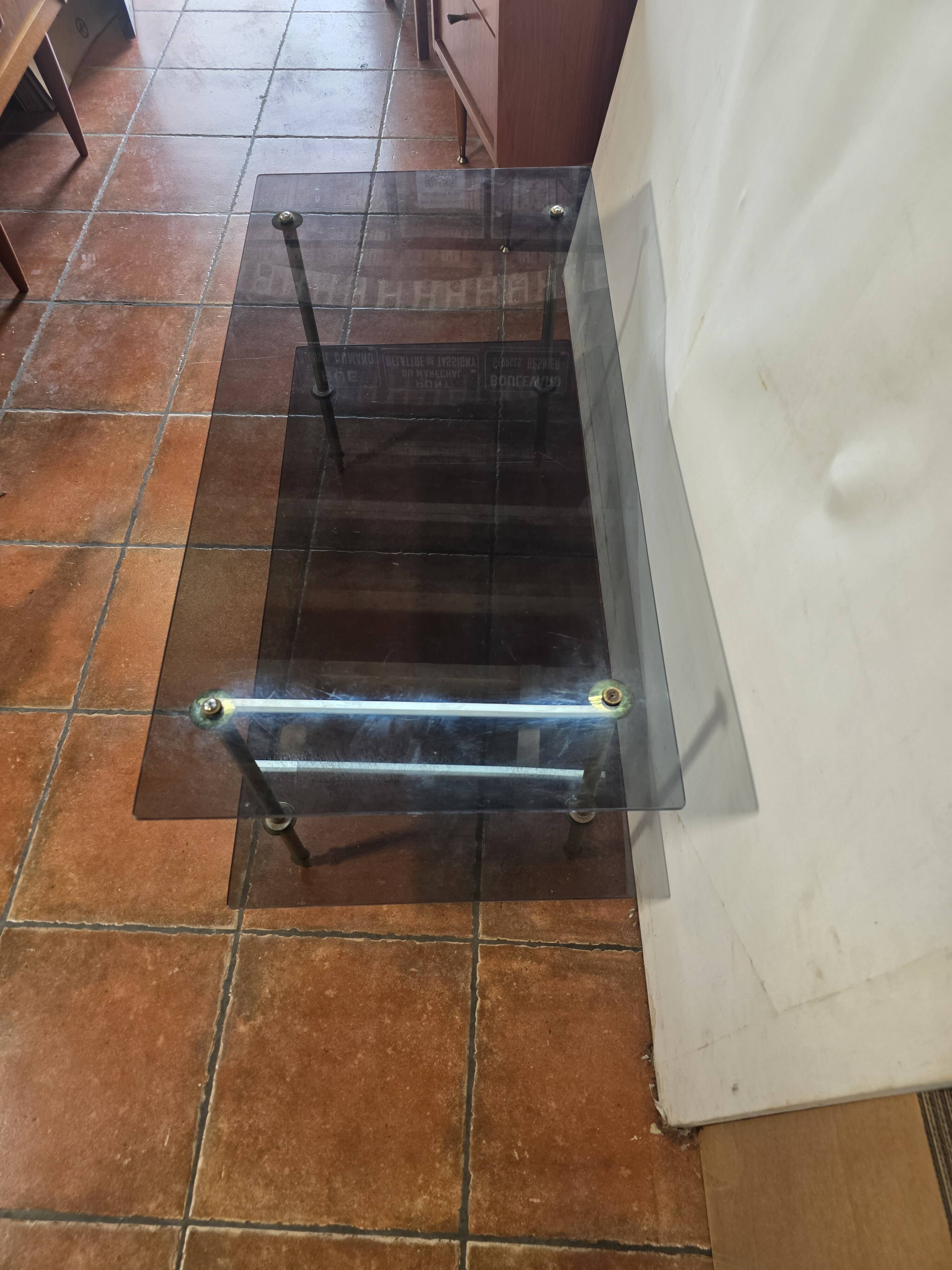 Smoked glass and brass coffee table from the 1970s.