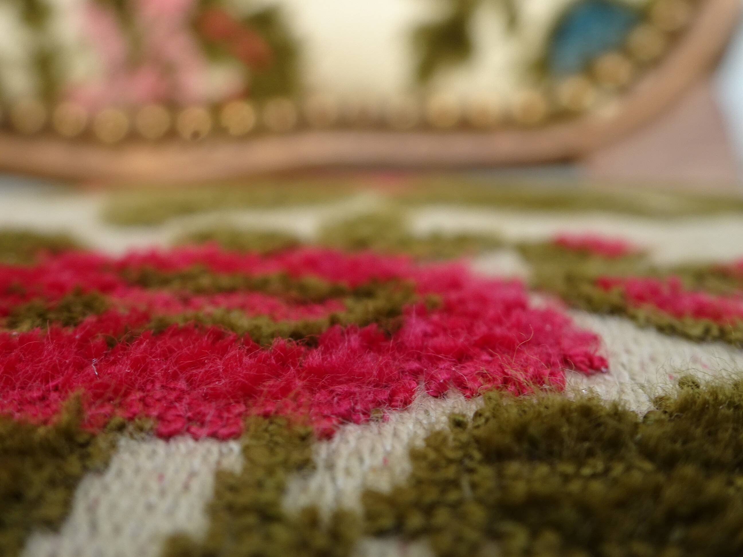 Convertible armchair with brocade fabric and floral patterns.