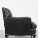 Armchair in black grained cowhide leather with a deep seat