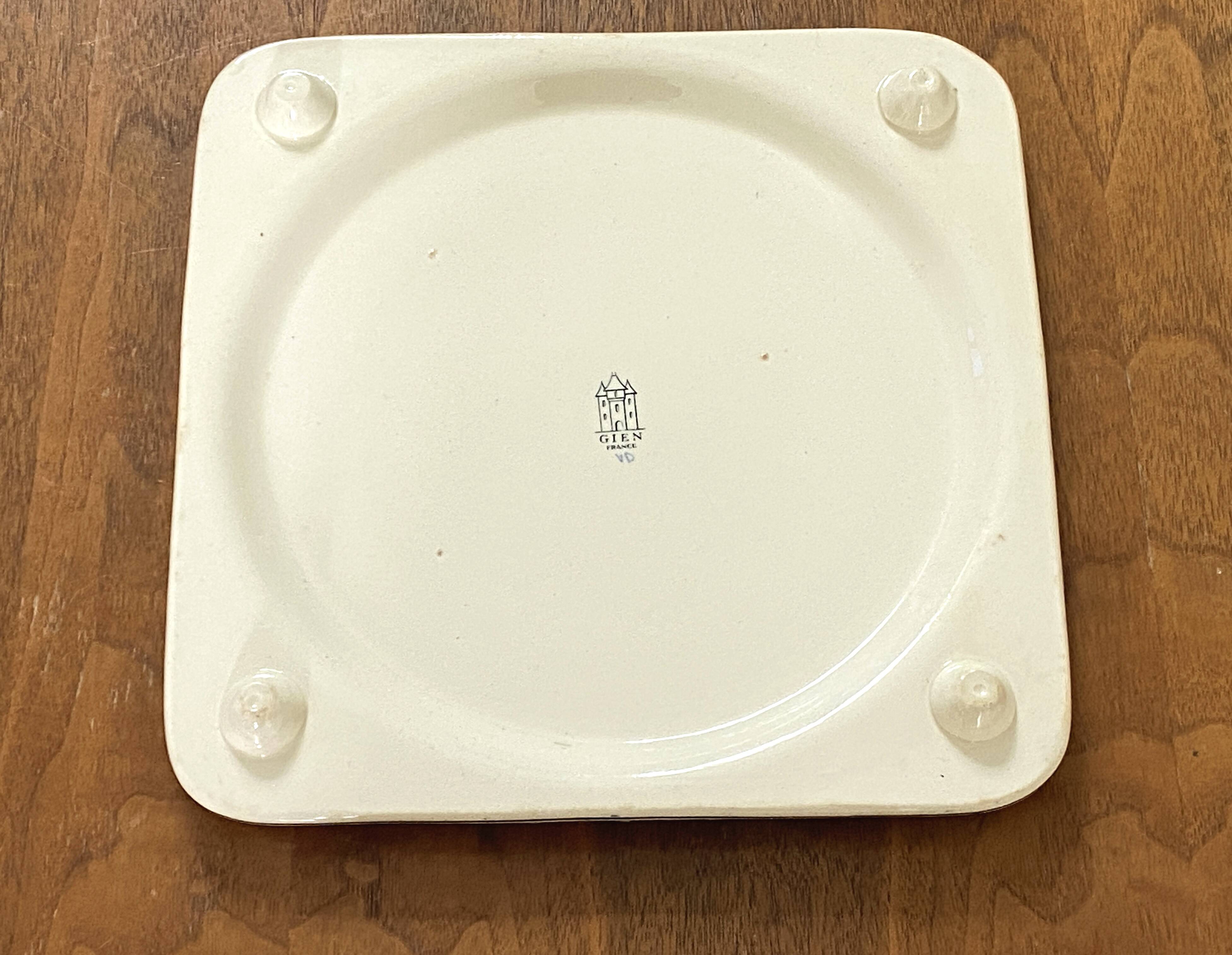 Vintage trivet in Gien earthenware with cornflower decoration.