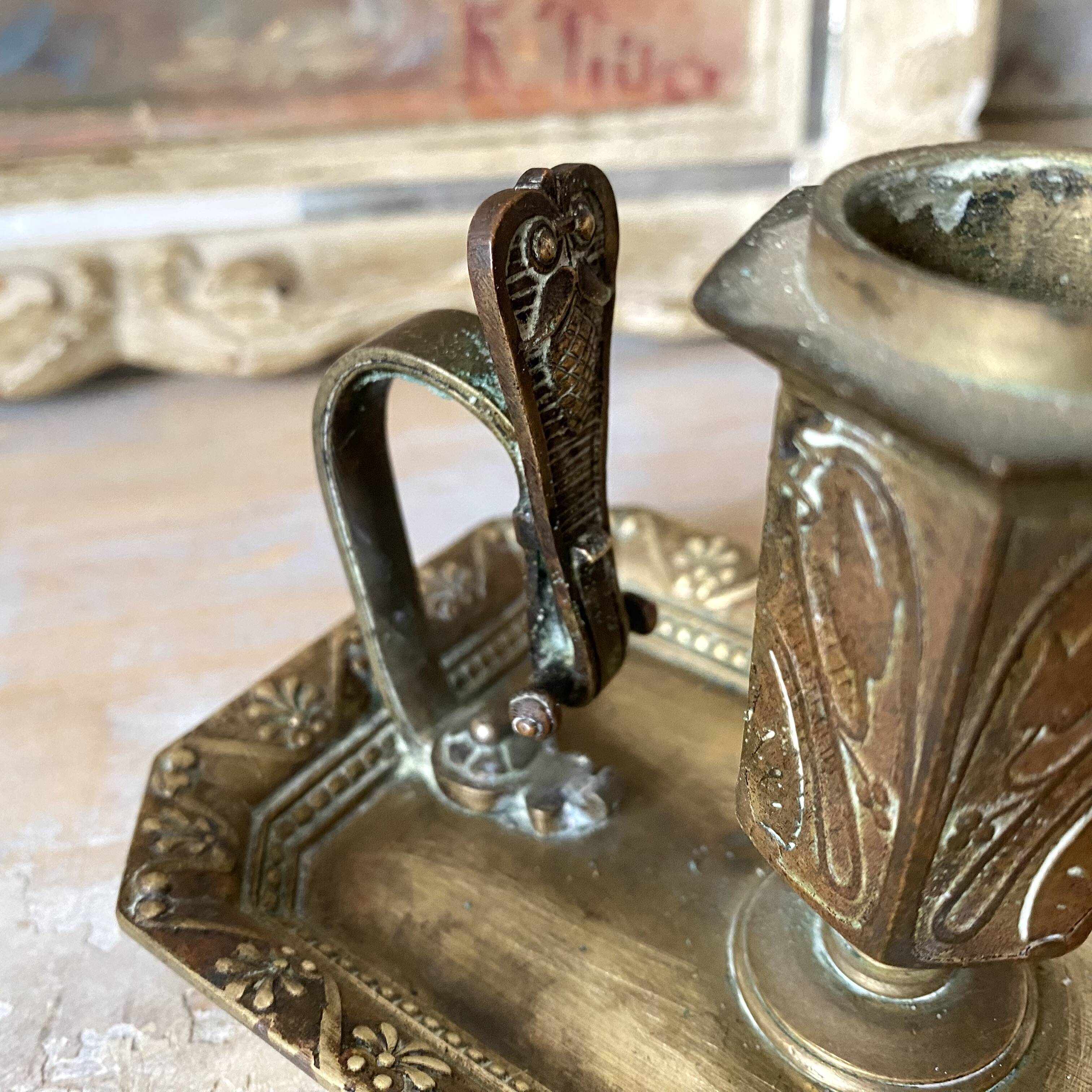 Antique brass thumb candle holder