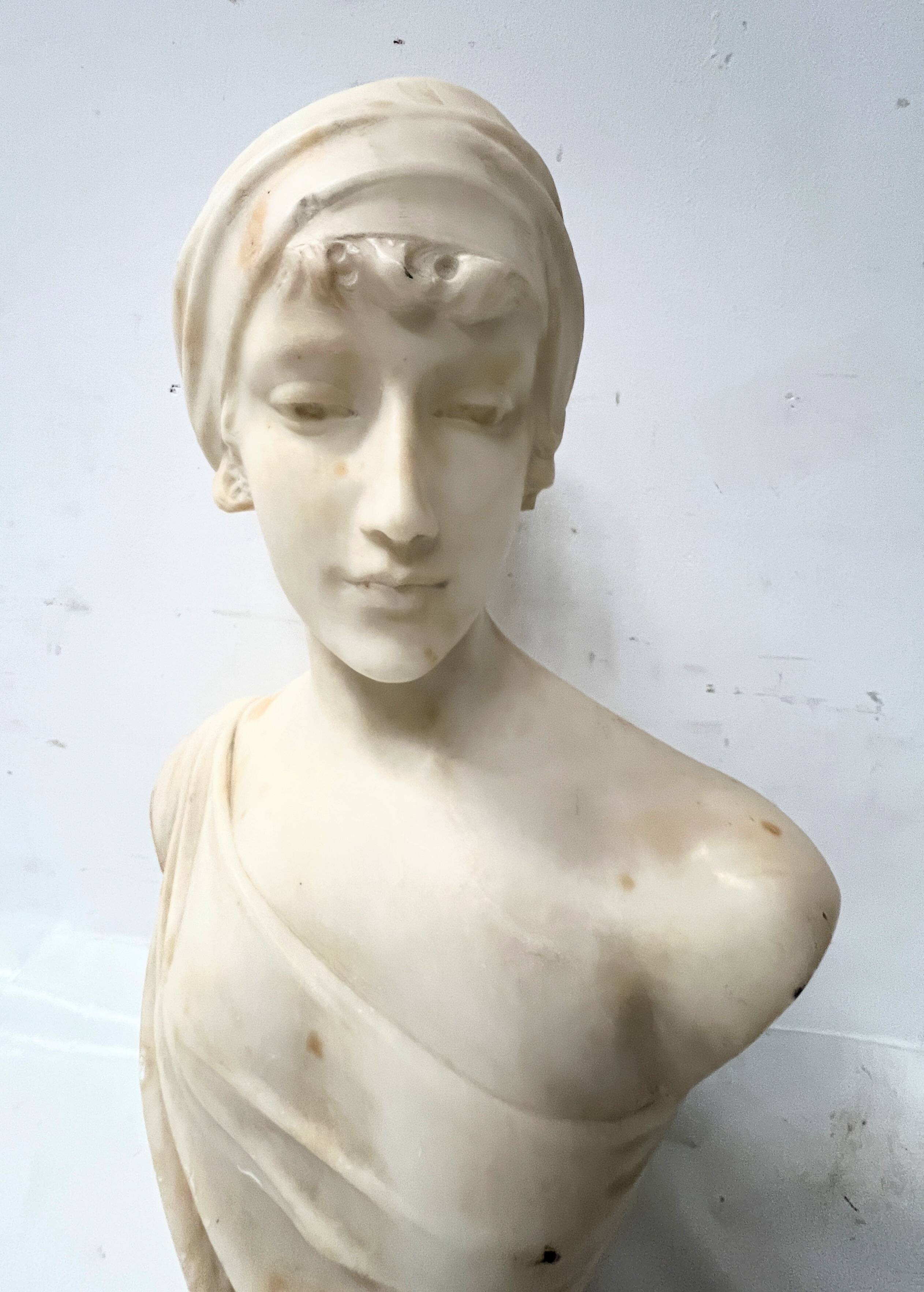 Sculpted marble group of a young woman's bust, 20th century.