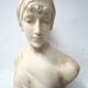 Sculpted marble group of a young woman's bust, 20th century.