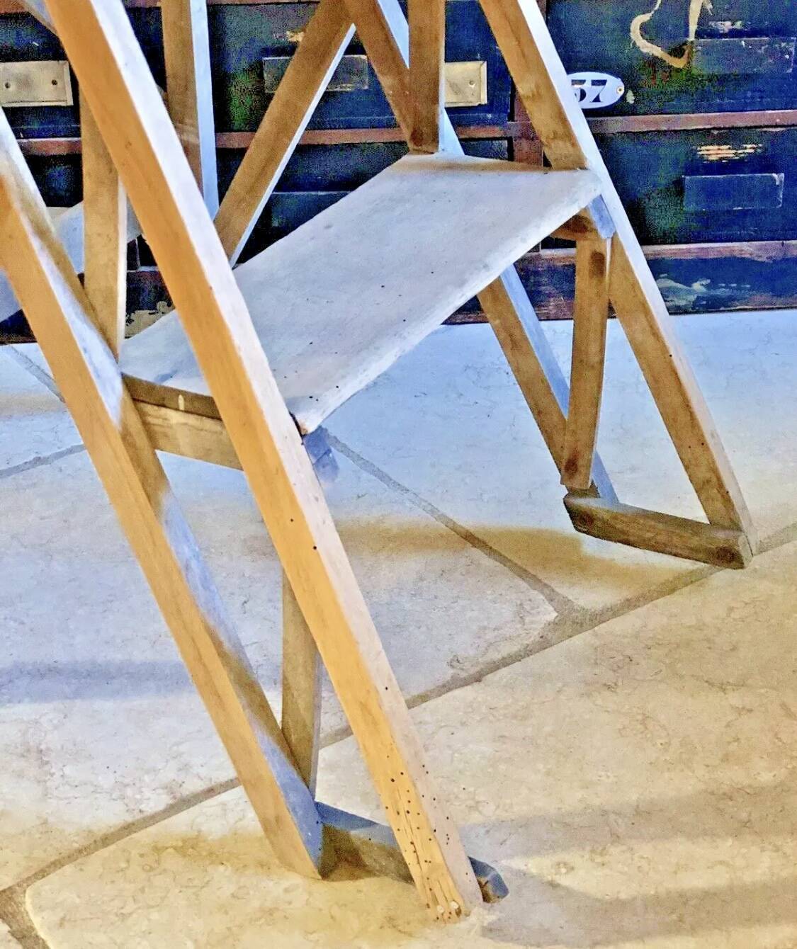 Old small painter's stepladder, wooden trade furniture, step stool