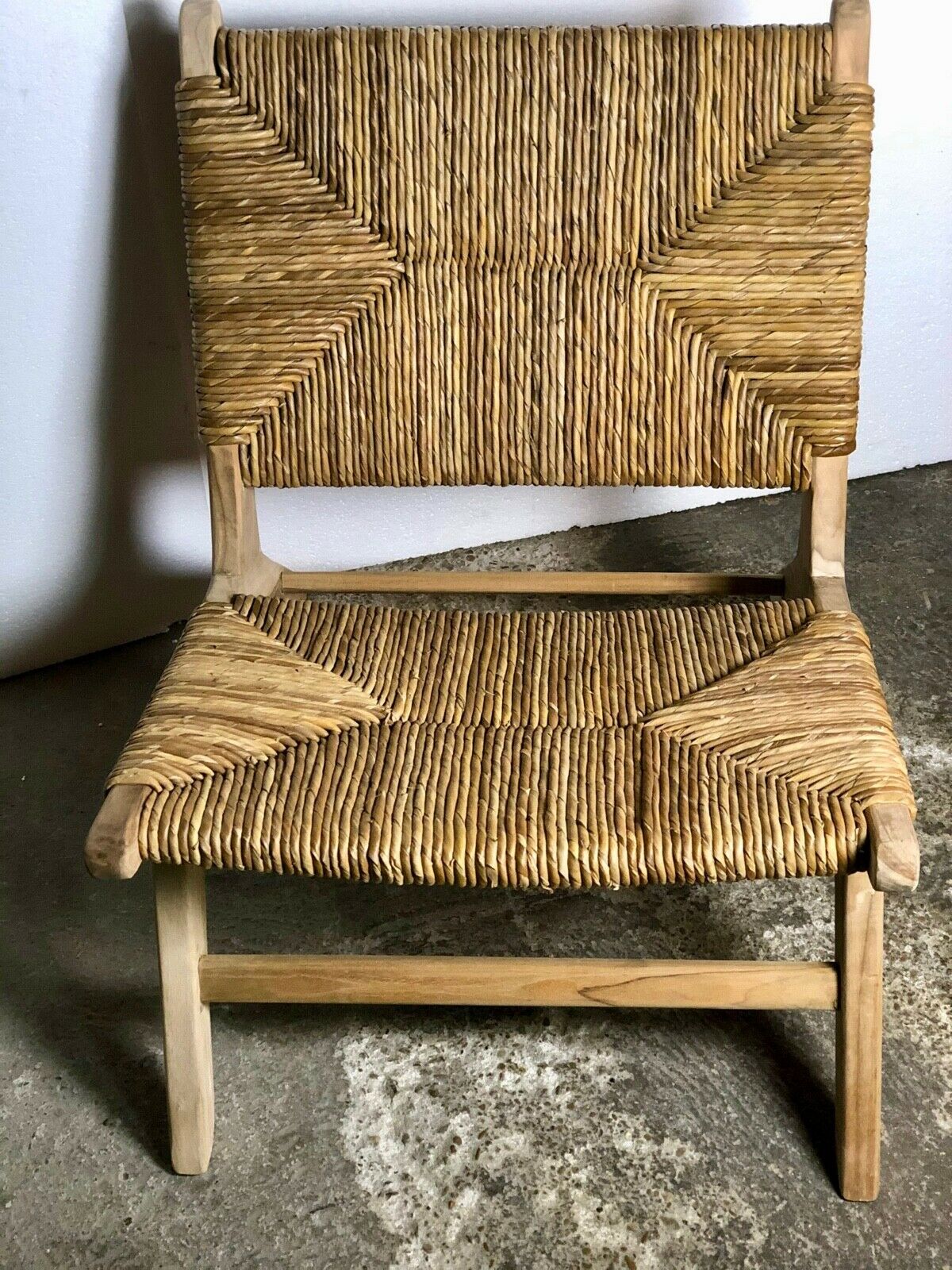 Low armchair in raw teak with seat and mulched backrest