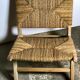 Low armchair in raw teak with seat and mulched backrest