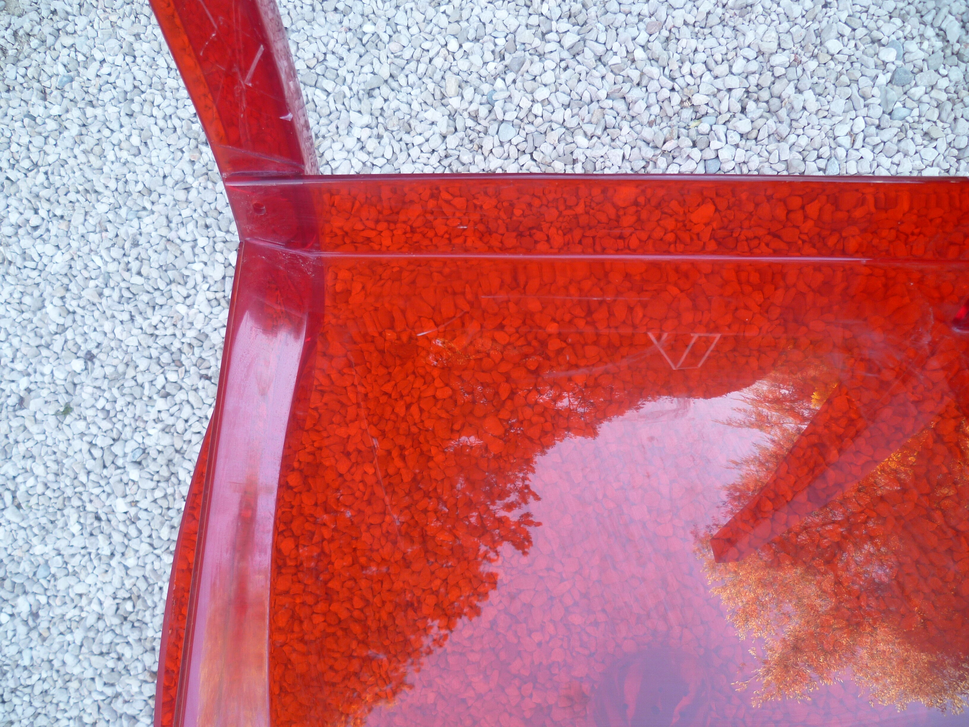 Orange design chair in polycarbonate plexiglass