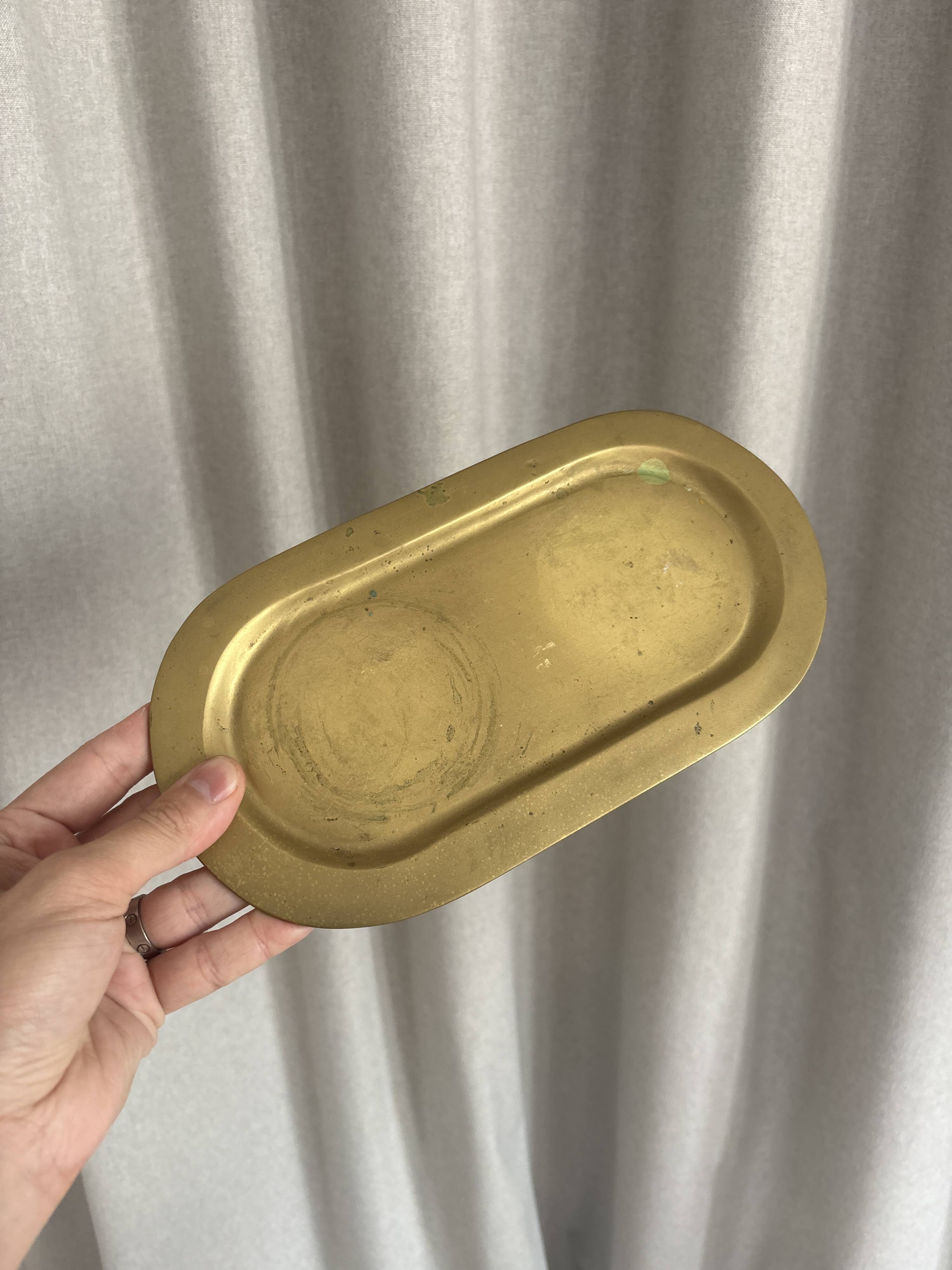 Empty pocket ensemble and bowl in solid brass signed Giò Lanciani.