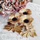 Low brass flower candle holder
