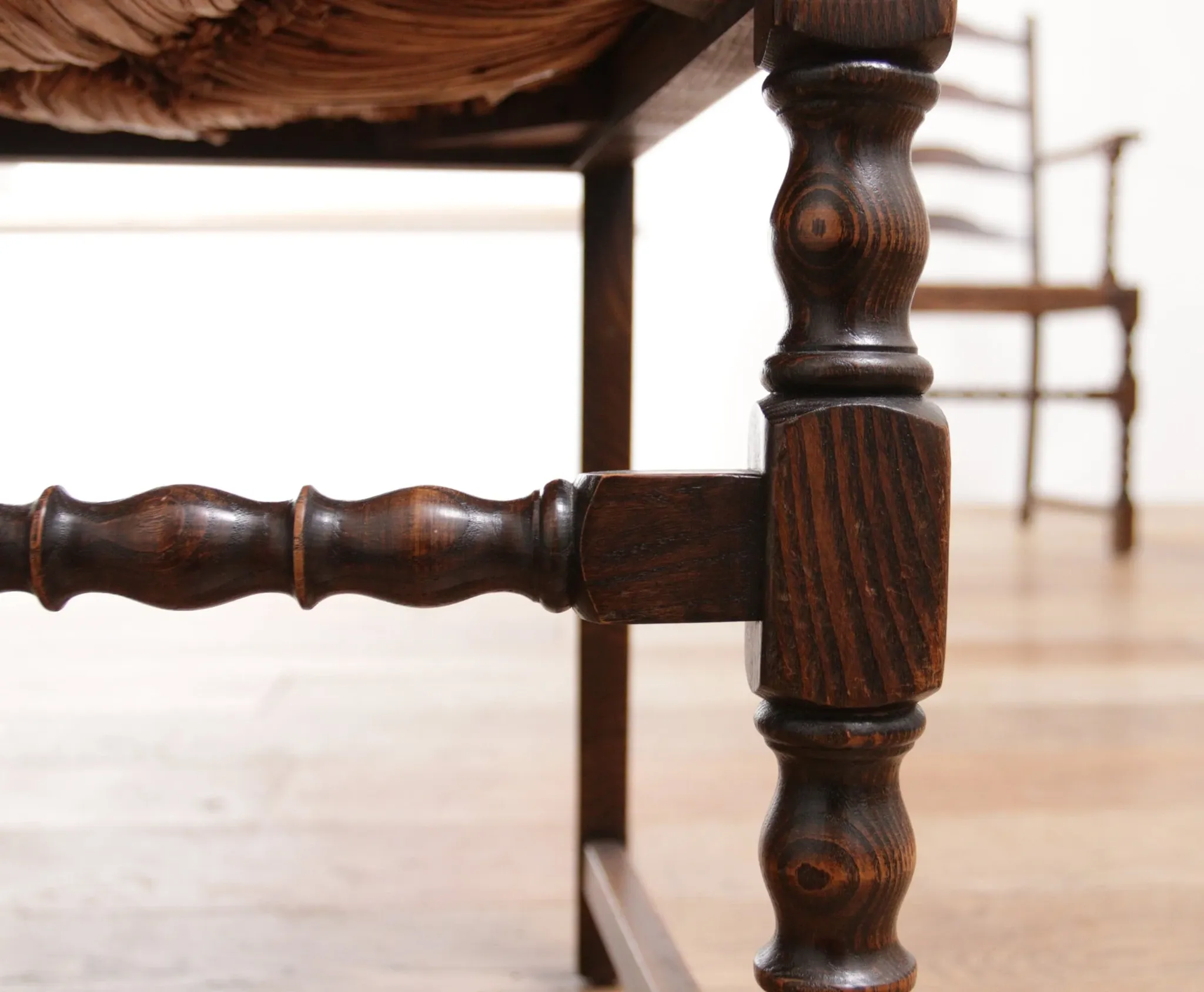 Pair of English oak armchairs with ladder back and rush seats