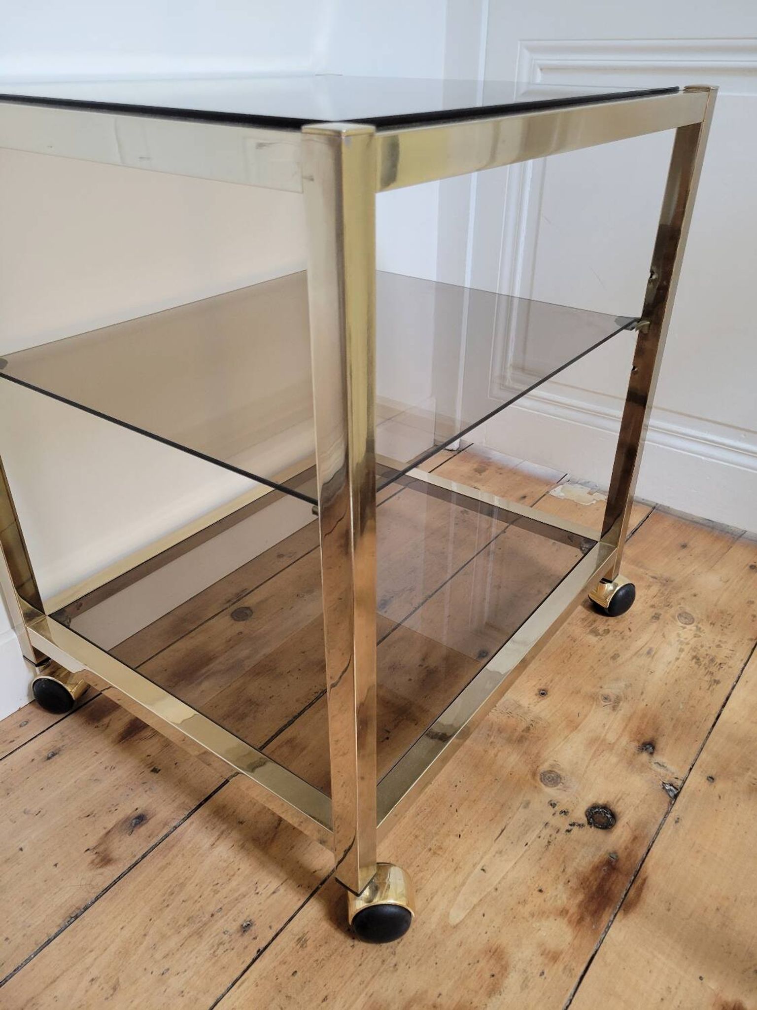 Gold metal and smoked glass serving trolley