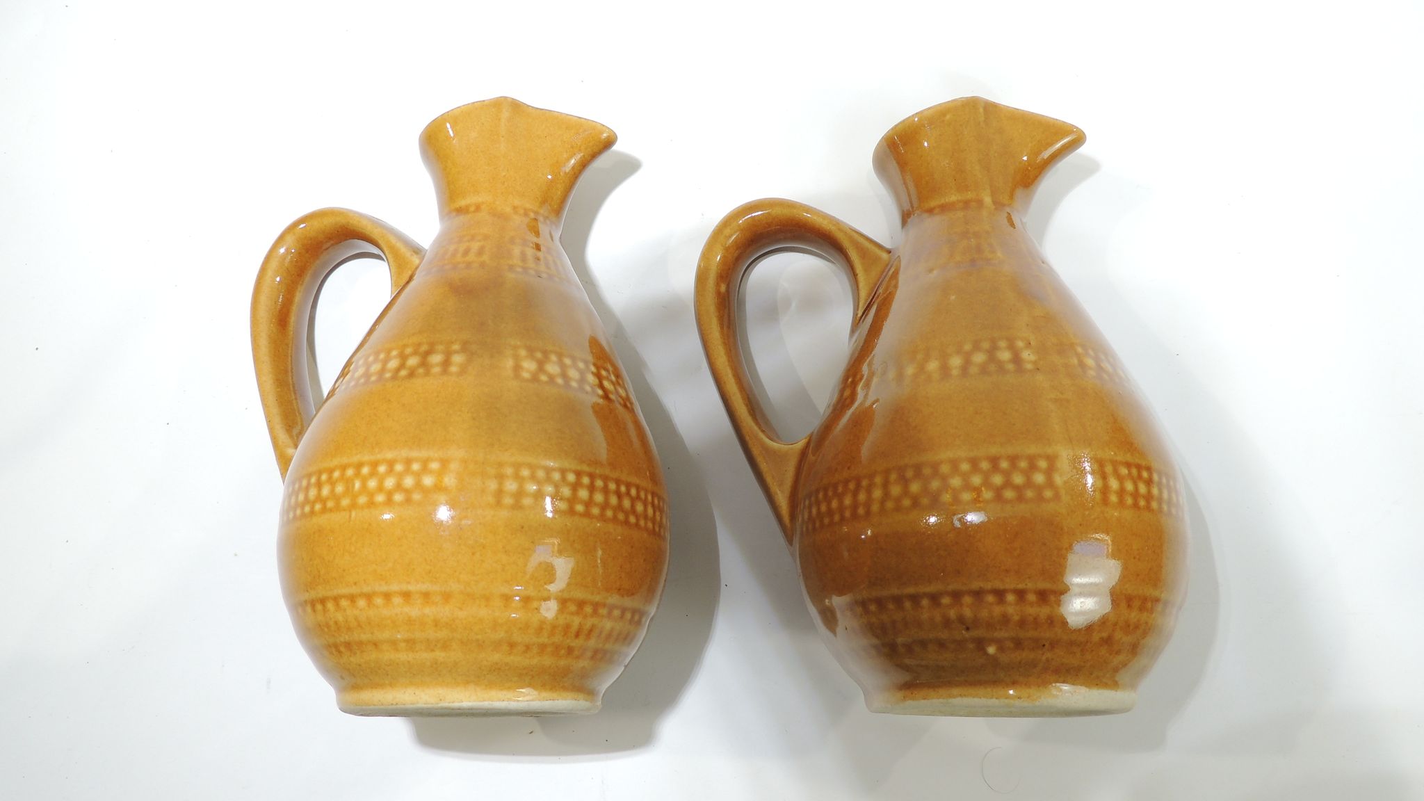 Pair of vintage stoneware pitchers