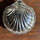 Vintage silver-plated shell butter dish with transparent bowl.