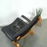 Fauteuil de lecture noir avec accoudoirs et support en bois