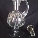 Wine carafe on foot, in cut and enameled glass