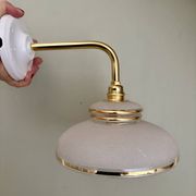 Vintage elbow wall lamp with white and gold granite glass shade