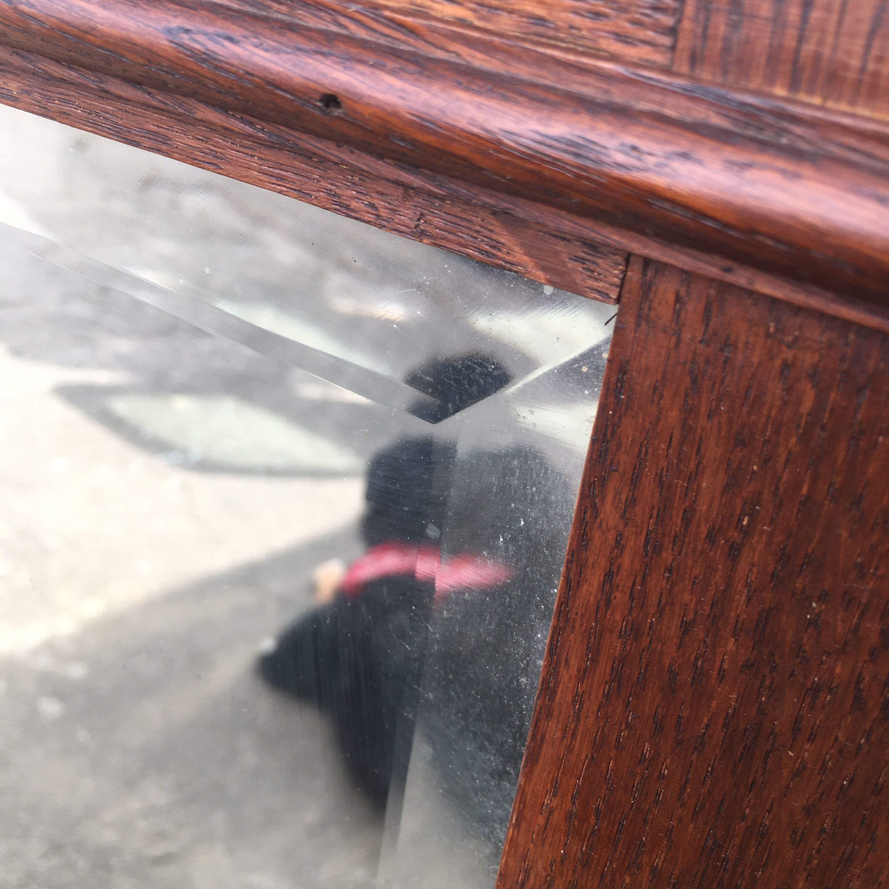 Beveled mirror made of fireplace wood