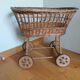 Wicker rattan doll cradle with wheels