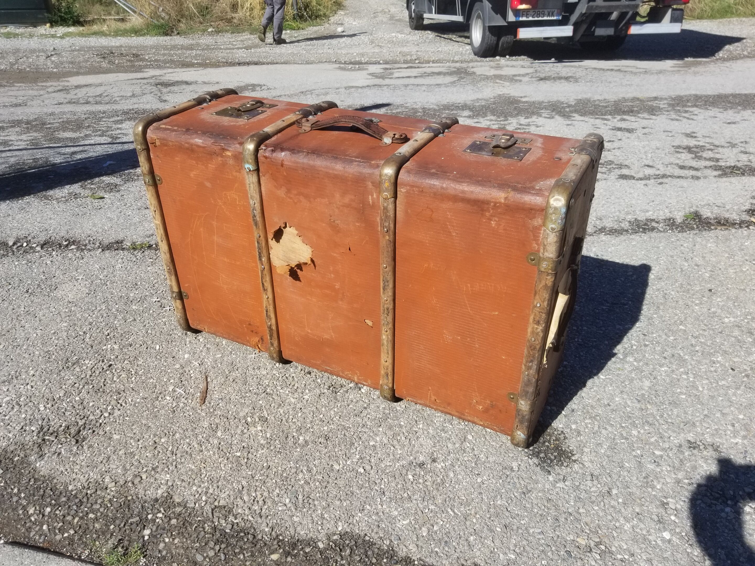 Old travel trunk made of wood and brass