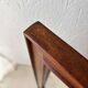 Danish wall mirror from the sixties with a sleek design.