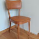 Bistro chair Baumann 1963 curved wood and skaï imitation leather caramel
