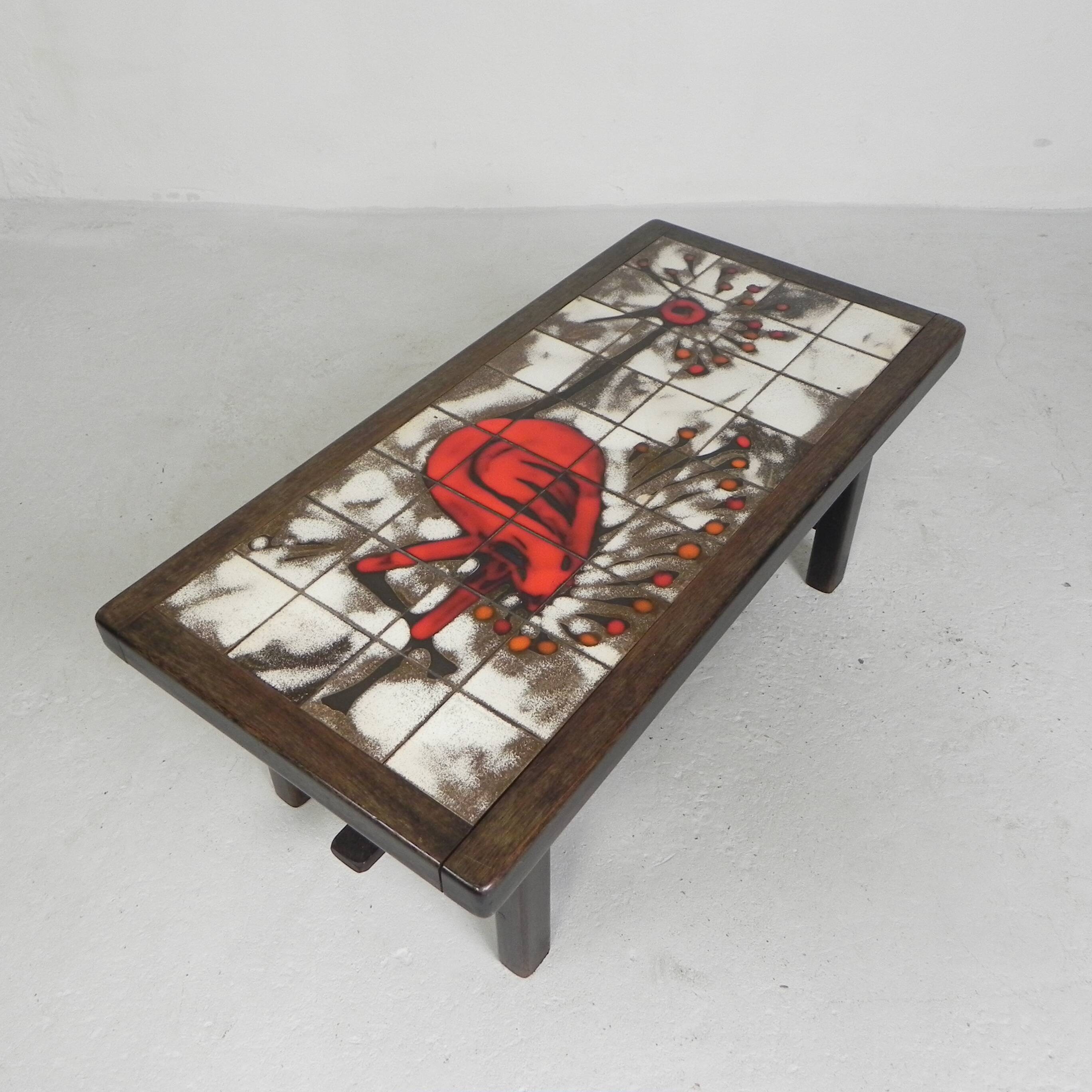 Square tile table from Vallauris, signed Dan with an image of a fantastic bird, 1960s.