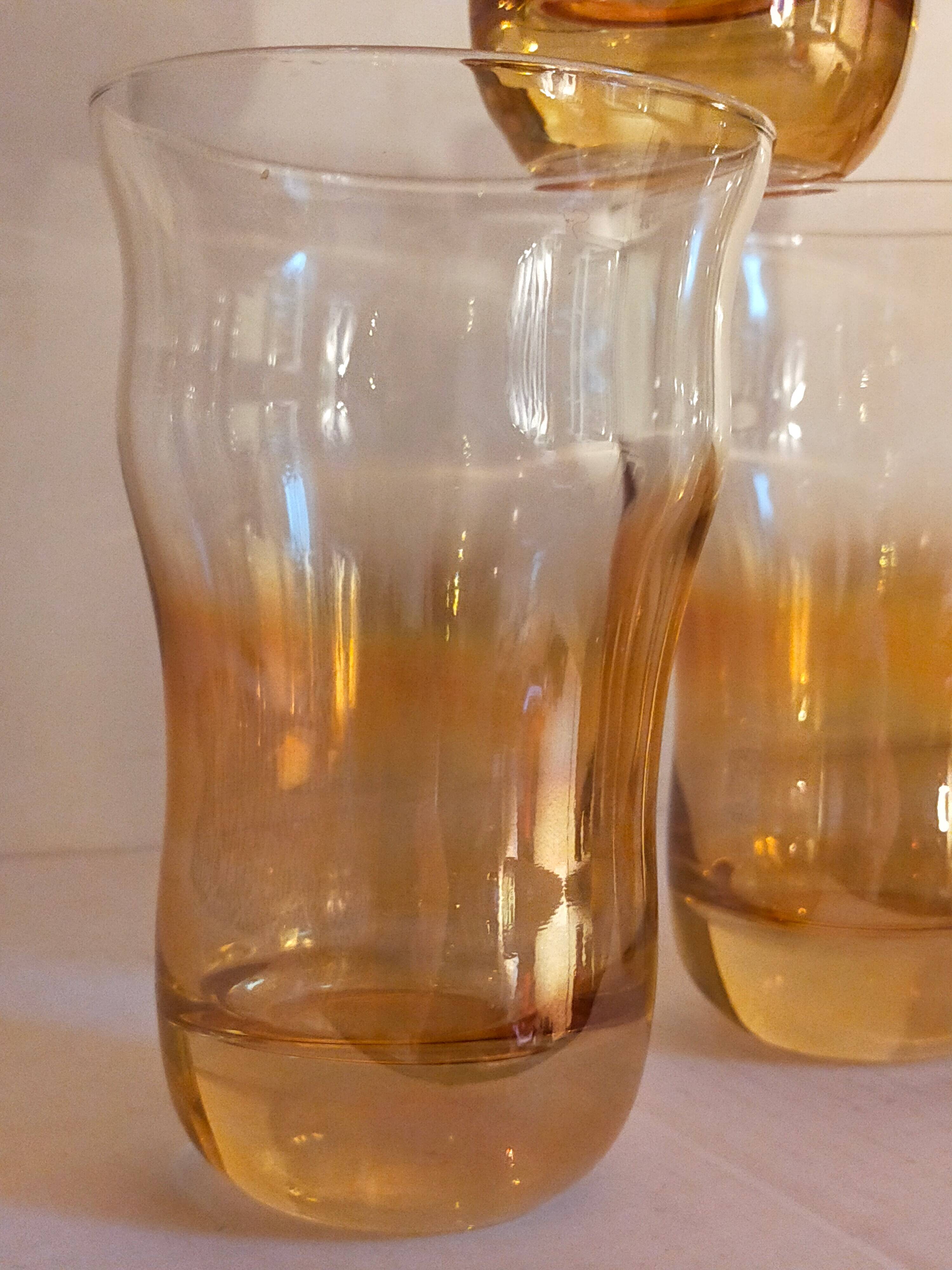 Four iridescent honey blown glass glasses