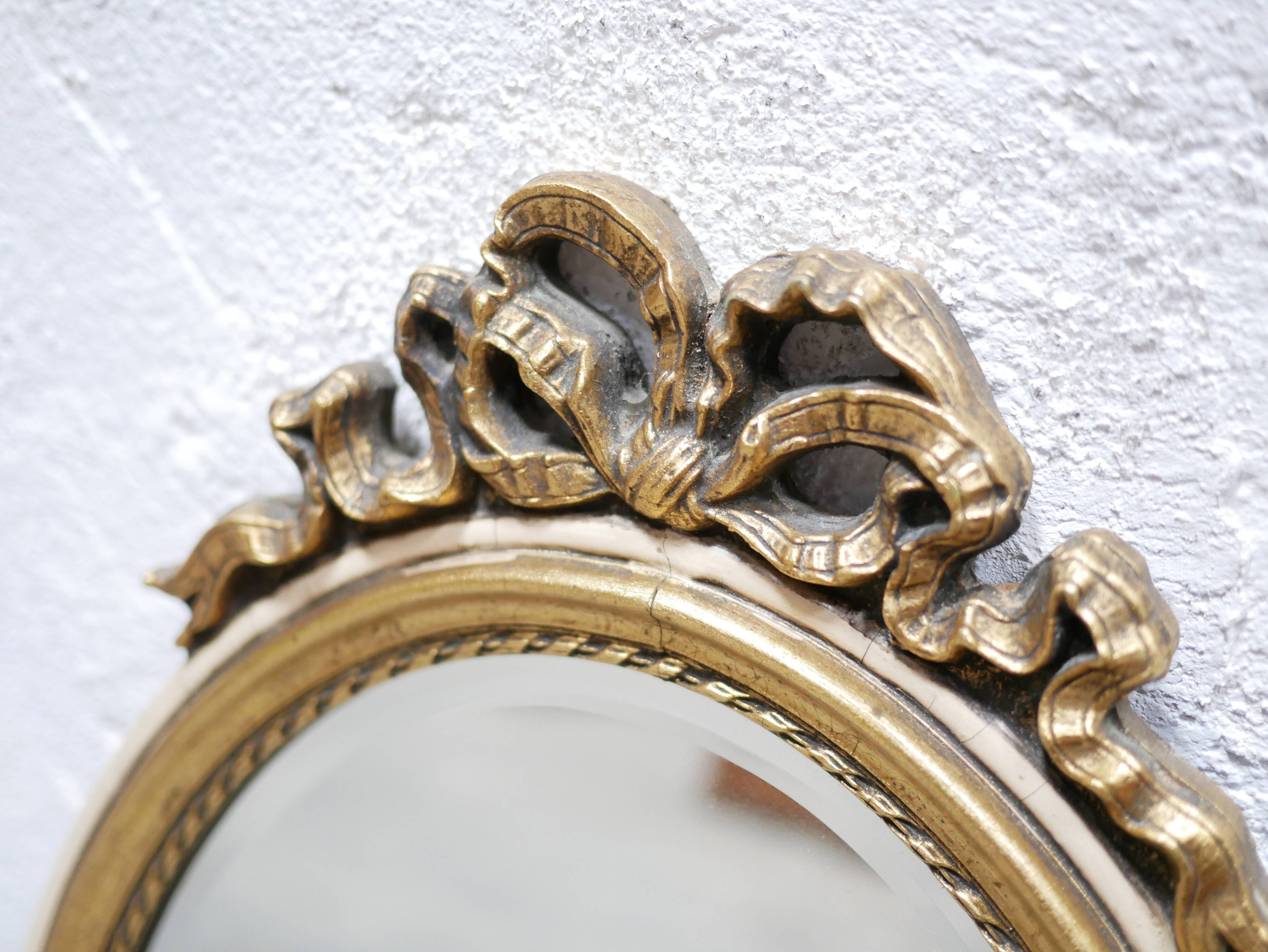 Old oval mirror Louis XVI style in gilded wood 50cm x 34cm