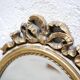 Old oval mirror Louis XVI style in gilded wood 50cm x 34cm