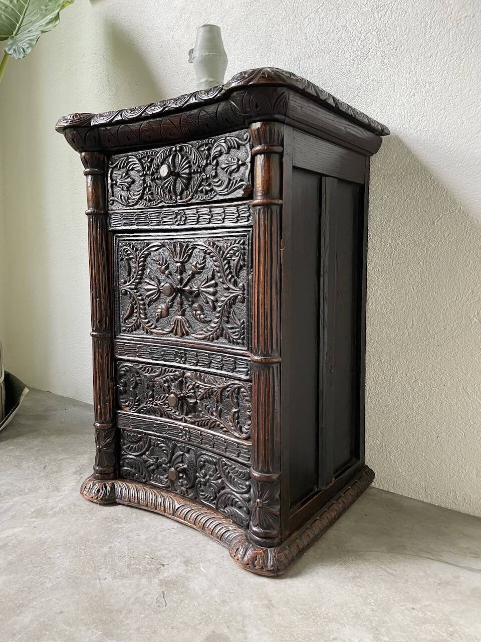 19th century chest of drawers in carved blackened pine