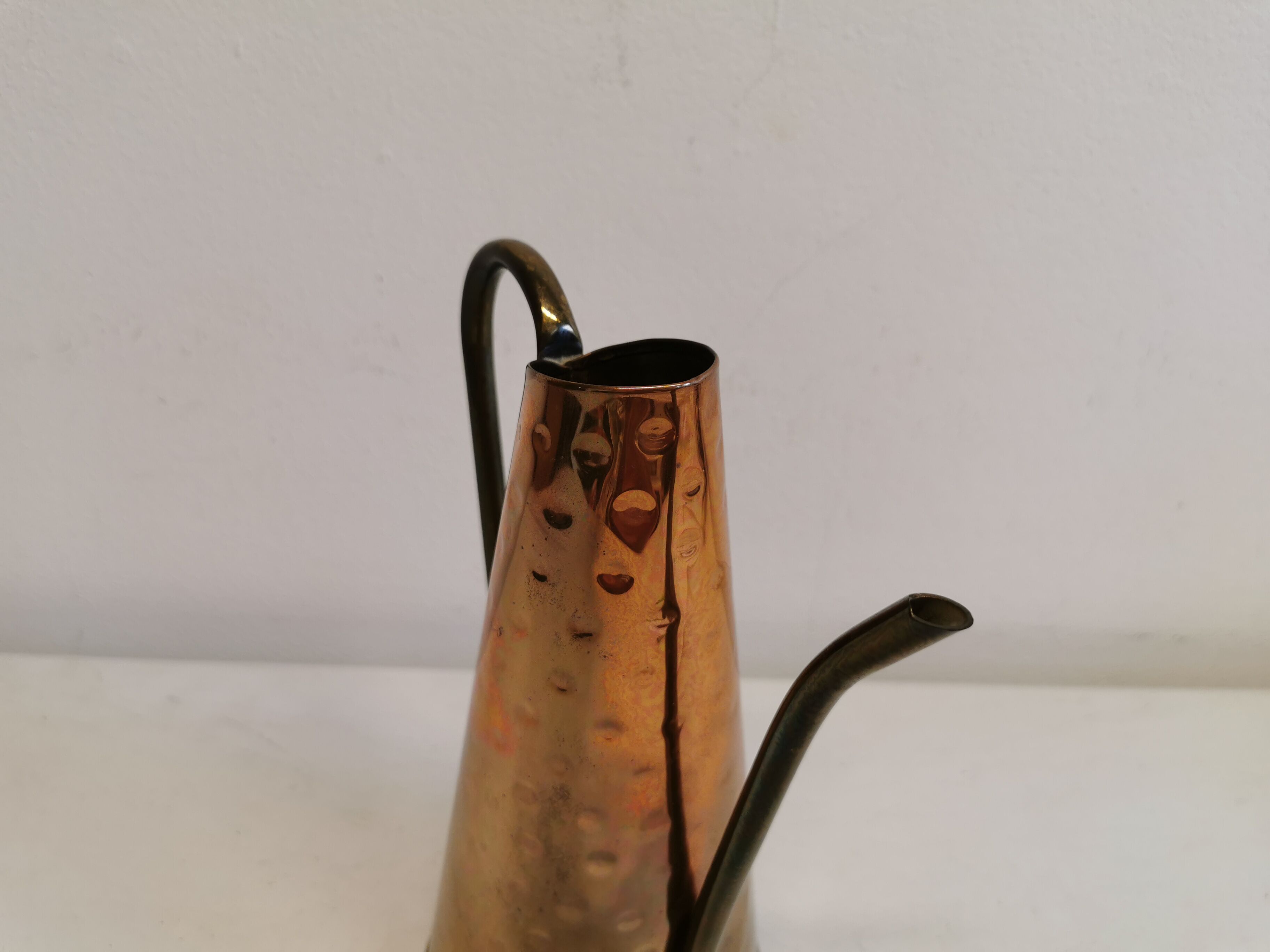 Watering can from the 1950s, made of hammered copper and brass