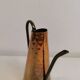 Watering can from the 1950s, made of hammered copper and brass