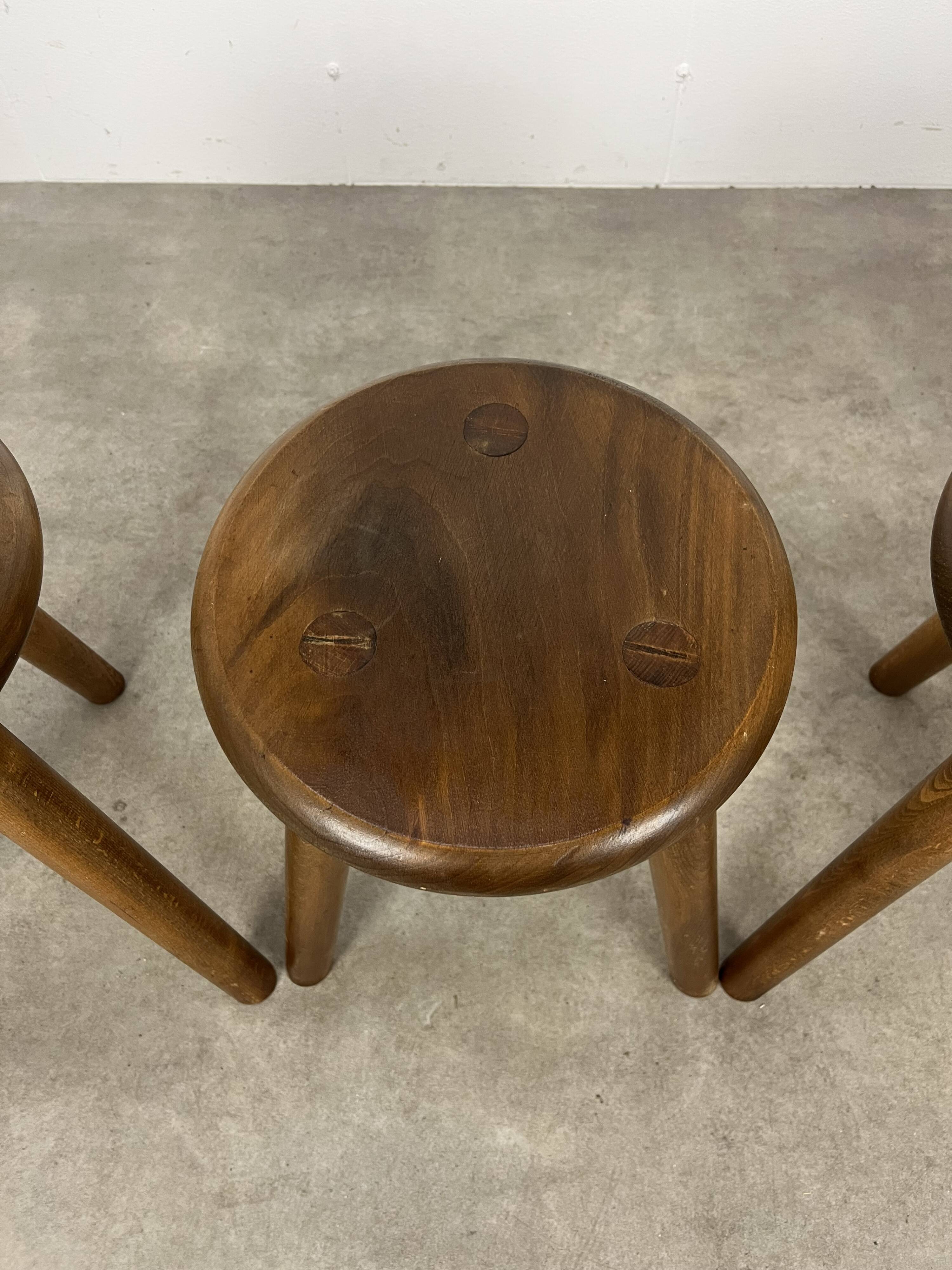 4 wooden tripod stools