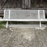 Old perforated metal garden bench