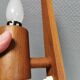 Wall lamp in teak with milky white cone-shaped shade in double glass