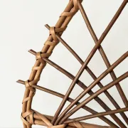 Wall-mounted plant holder in rattan