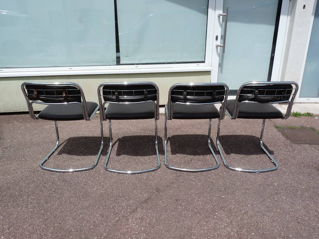 Set of 4 chrome metal and vintage leather chairs