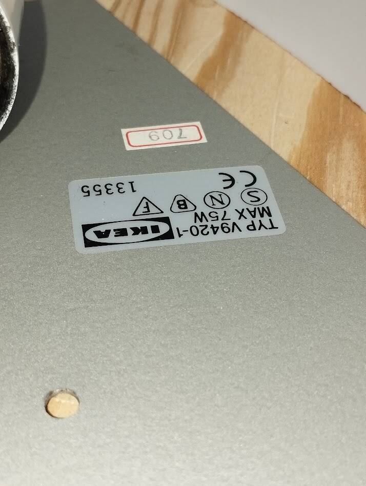 a pair of Ikea Kvintett wall lamps