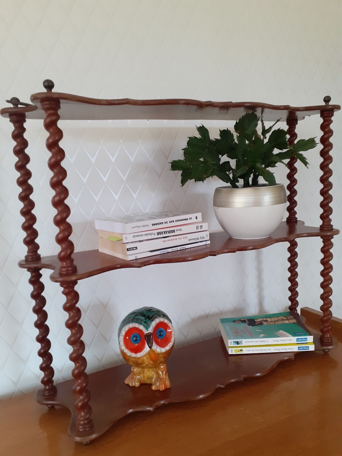 Turned wooden wall shelf