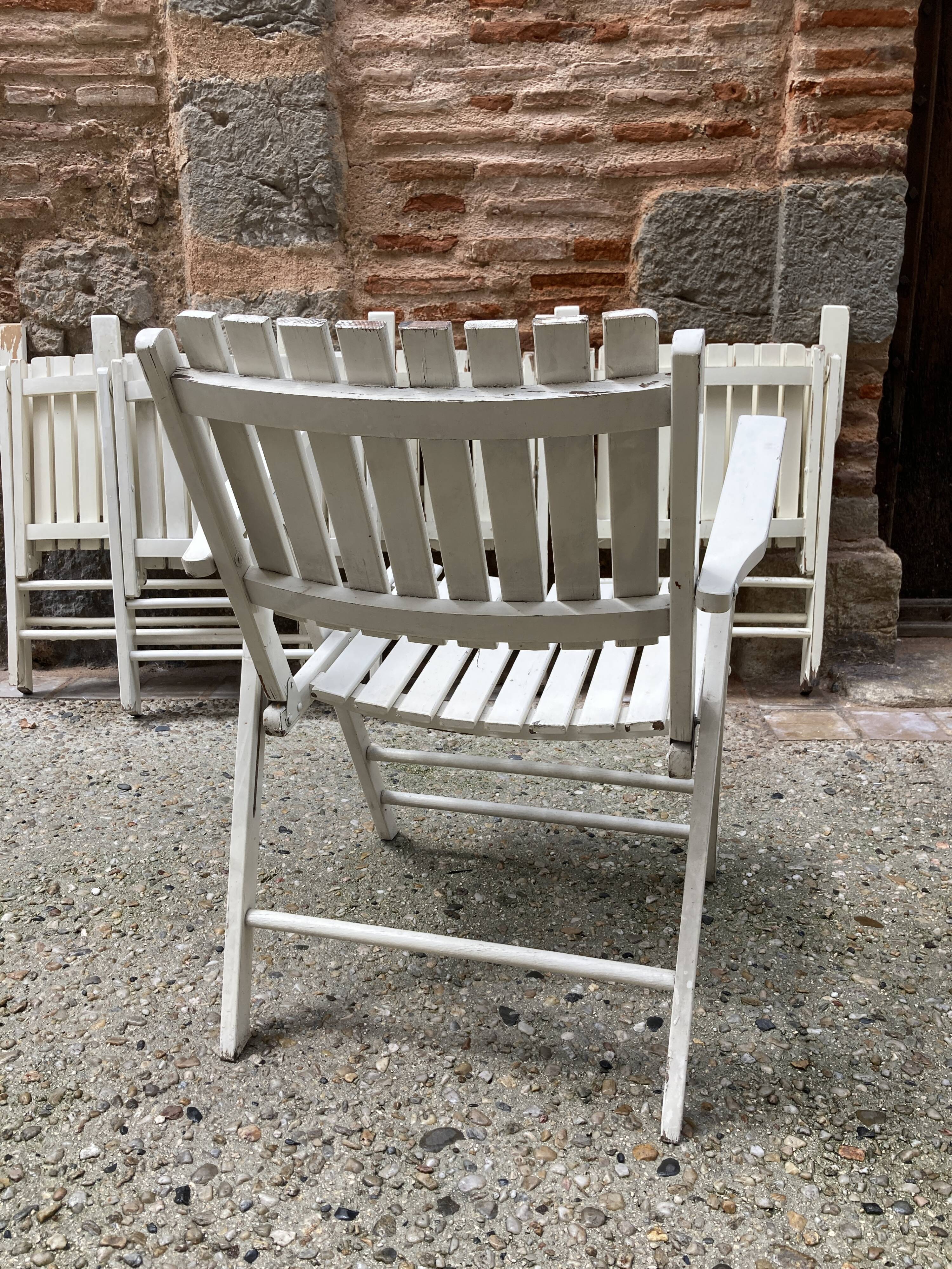 Five wooden garden armchairs