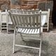 Five wooden garden armchairs