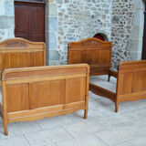 Pair of beds and Art Nouveau bedside in oak, France, circa 1910