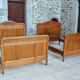 Pair of beds and Art Nouveau bedside in oak, France, circa 1910
