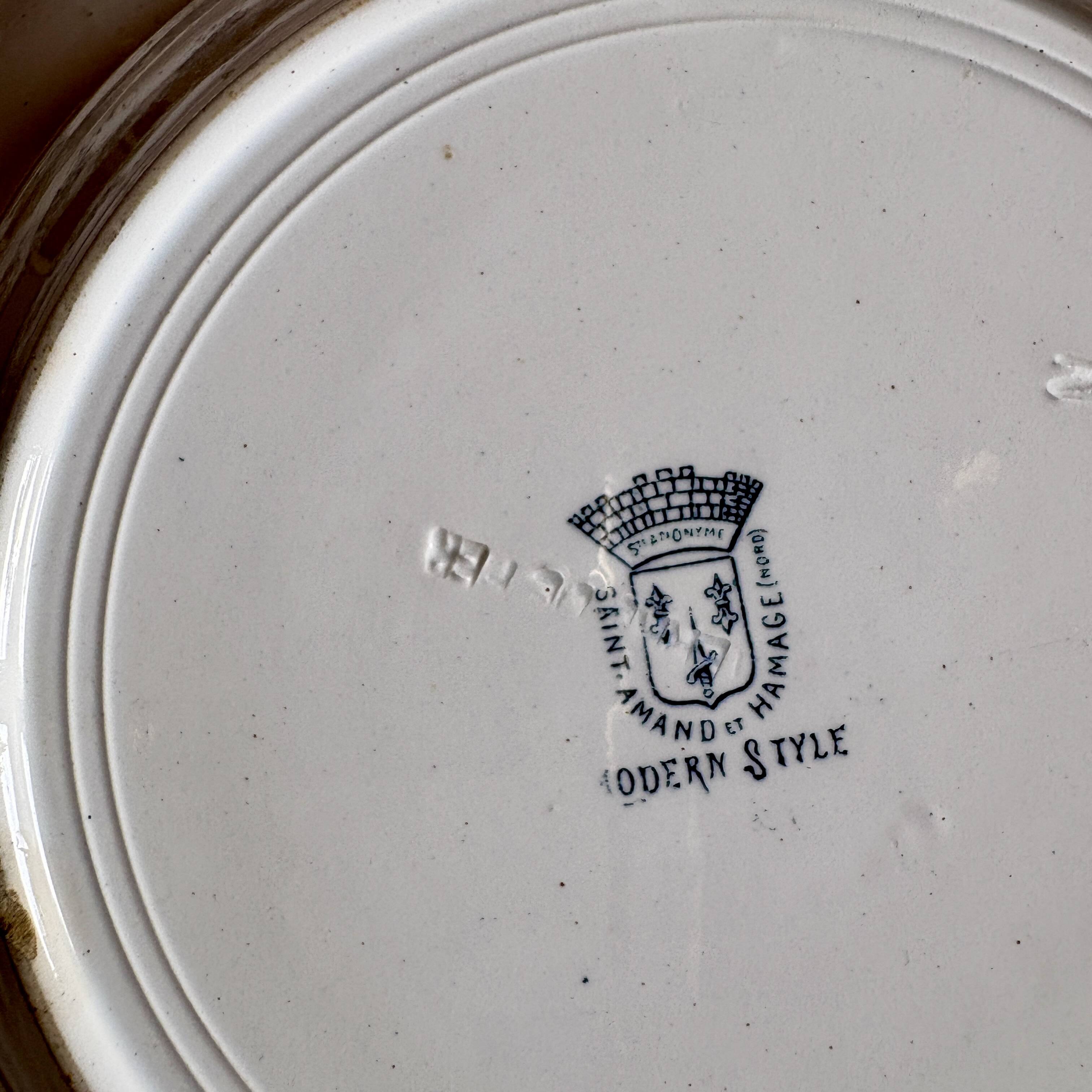 Set of 8 mismatched antique ironstone deep plates.