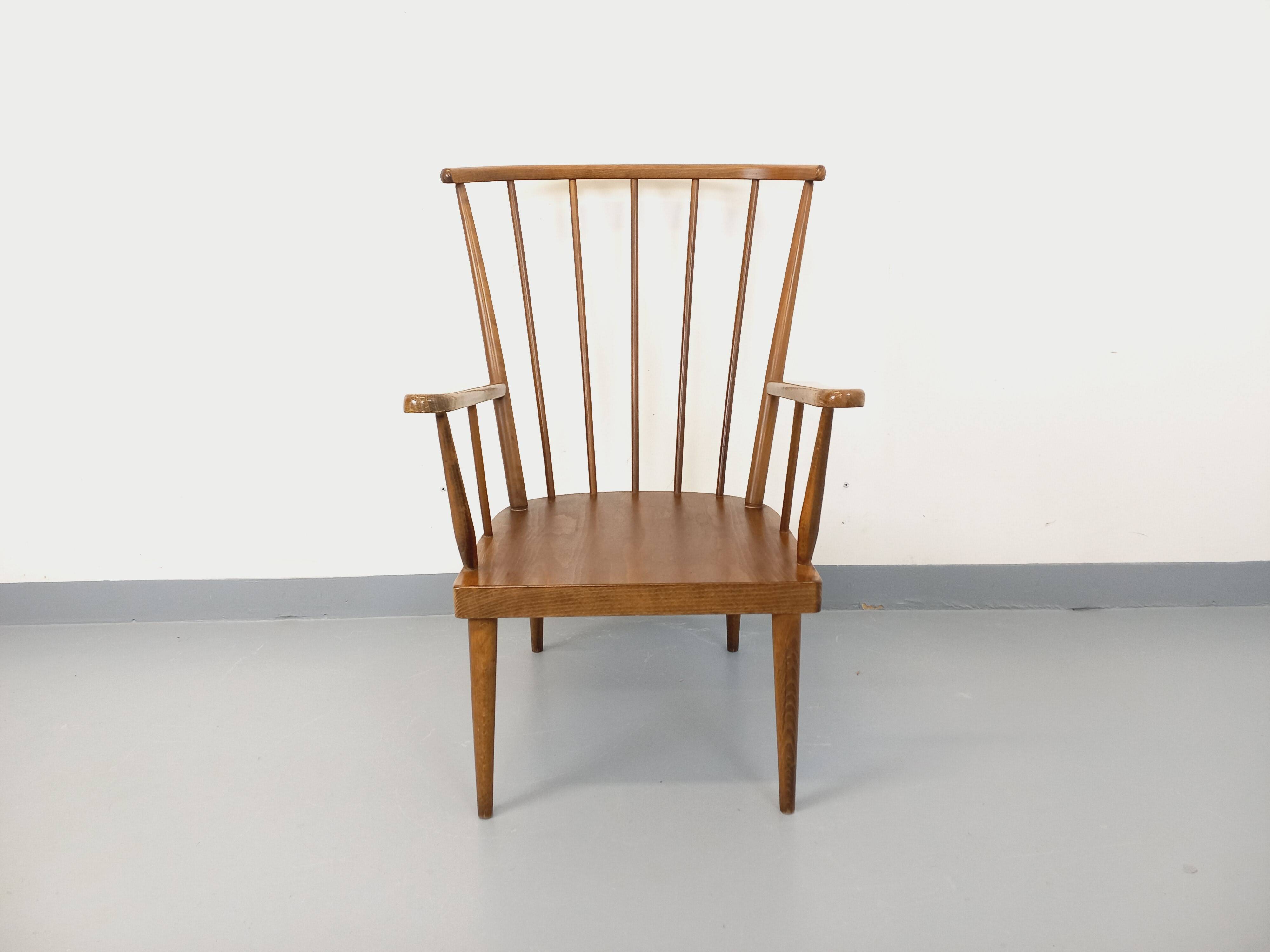 Vintage wooden armchair Baumann model Éventail from the 1960s.