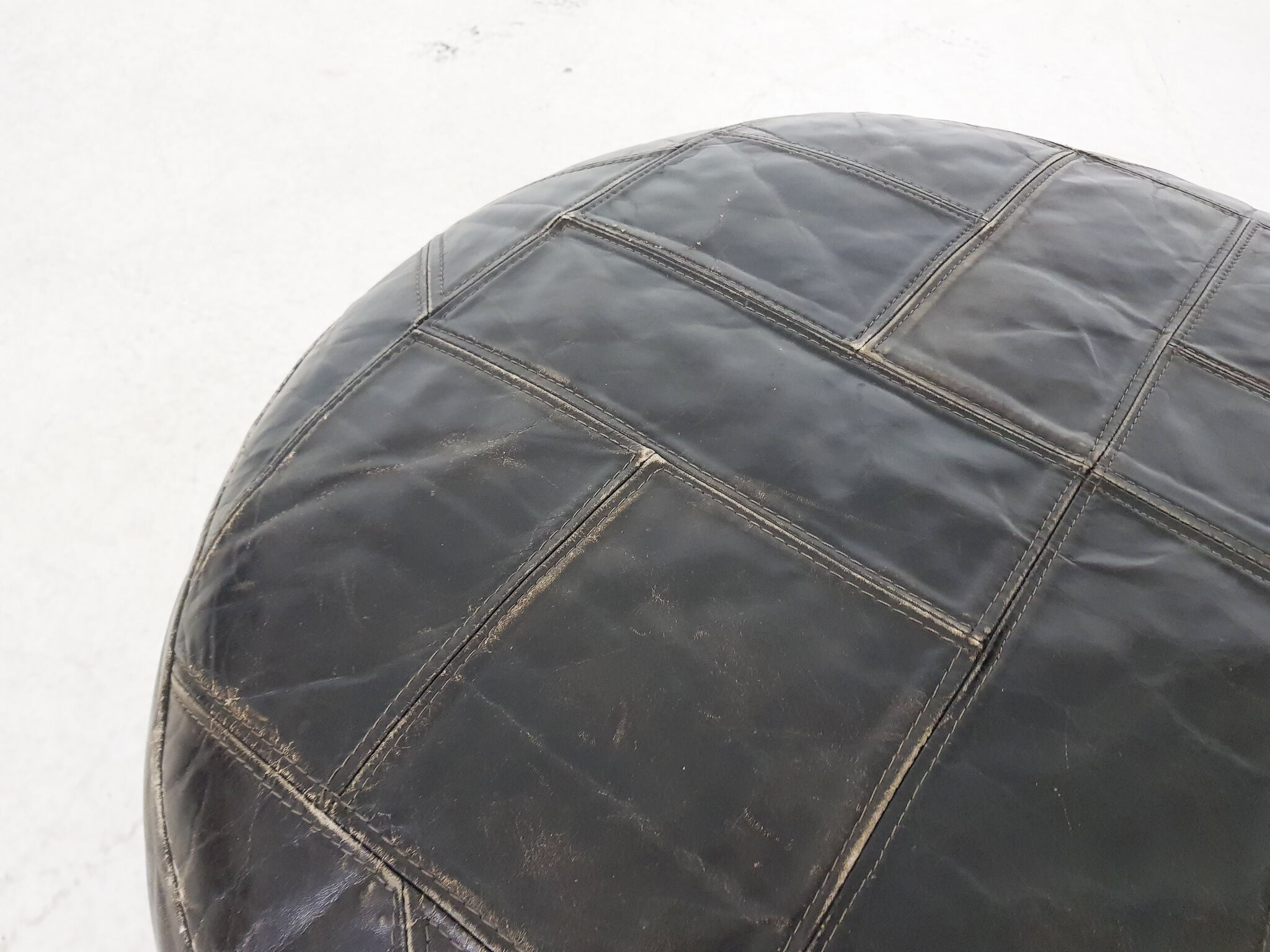 Mid-century round leather ottoman