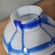 Old white and blue glass flower vase